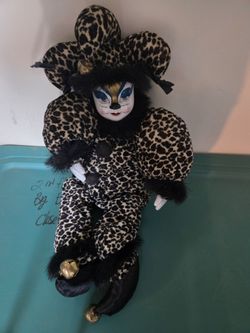 Porcelain clown in leapord clothing