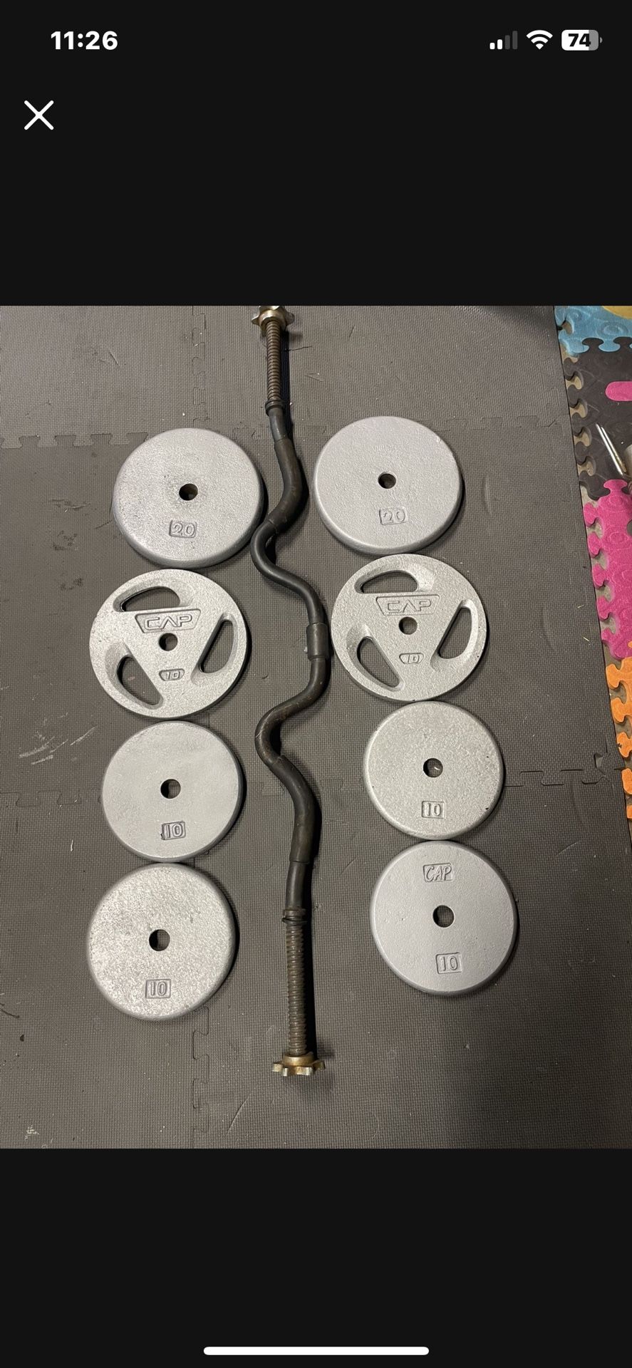 Weight Plates / Curl Bar. 70 Dollars