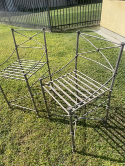 Two tube iron chairs
