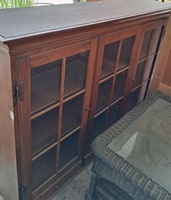 Large teo piece hutch or cabinet with glass doors and shelves