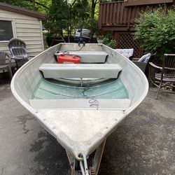 Sears Boat With 9.9 Nissian Outboard 