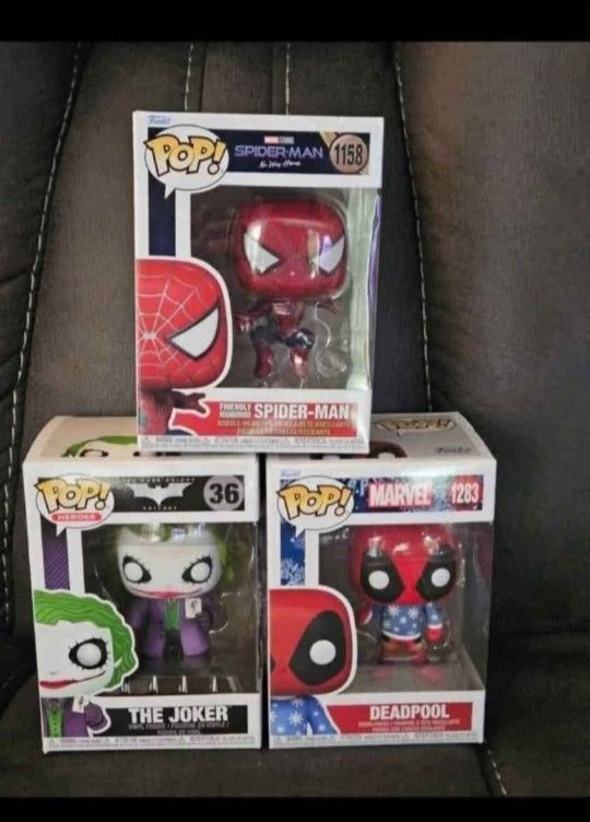 Comic Book Funko Pop Bundle. Spiderman, Christmas Deadpool, and The Joker.