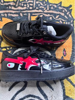 Black and red BAPE x Billionaire Boys Club trainers