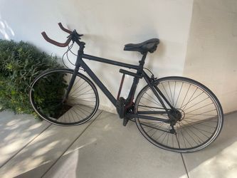 Matte black aluminum frame road bike - all in good condition, just needs new tube.