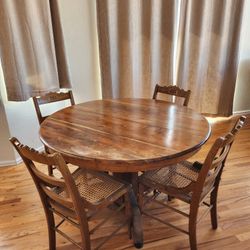 Extending Round Dining Pedastal Table and 4 Cane Chairs