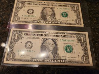 Two of rear dollar bills- star notes