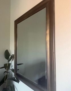 Refurbished mirror.  Gold and black speck color