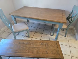 Table with two chairs and bench