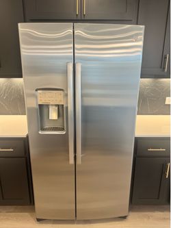 Brand new GE package!  Refrigerator, washer & dryer