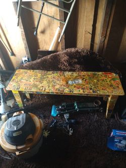 Wooden Bench With Bad Ass Stickers On It