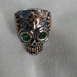 Skull ring silver With gold.
 Tone and Emerald fashion Stone.