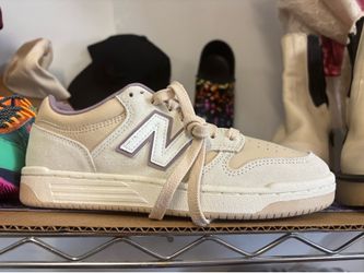 New Balance 480 sneakers in a tan and white colorway