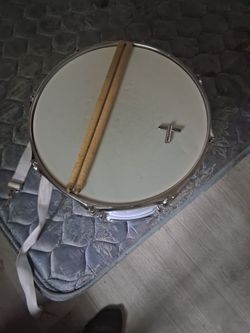 Modern Day marching snare with sticks and a tuner