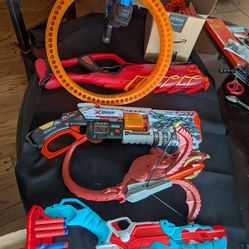 Lot of nerf toy and xshot guns and foam shots
