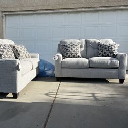 Brand New. (Set of 2) Lane Love Seat Sofa’s. Tweed color with accent pillows.  $549