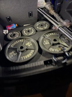 Very nice looking Brand new 45, 35 lb, and 25 lb Olympic weight plates and brand new Olympic barbells