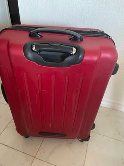 Red suitcase in good condition
