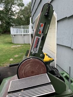 Central machinery belt and disc outlet sander