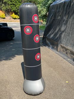 Inflated punching bag with weighted base
