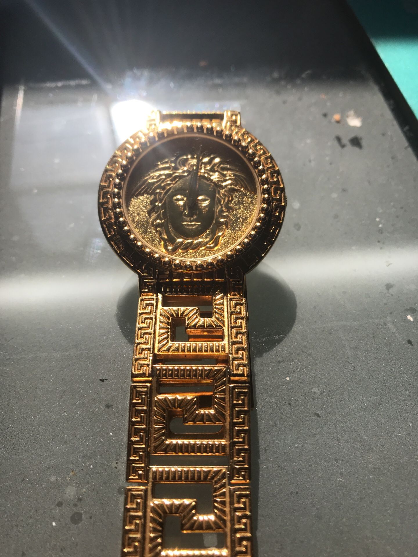 Gianni Versace Goldplated “Medusa face coin” serial number 00736