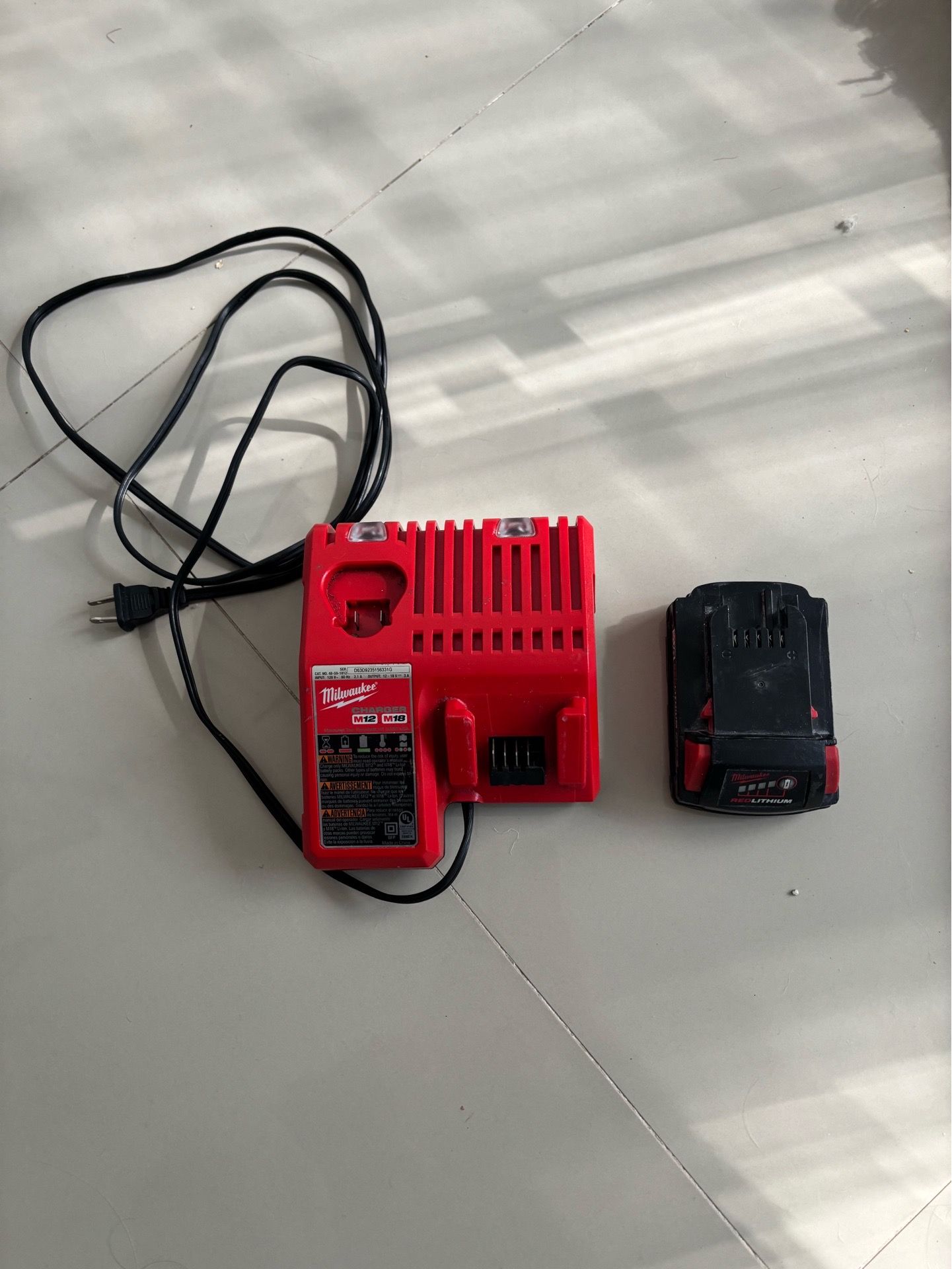 Milwaukee M12 and M18 Multi-Voltage Battery Charger & cordless drill