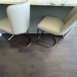 2 CB2 Leather and Brass barstools