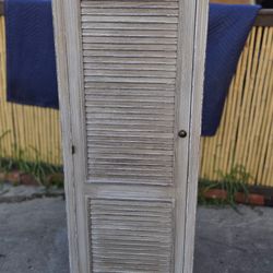 Cabinet with louvered