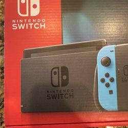 Nintendo Switch With Neon Blue And Red Joy-Con