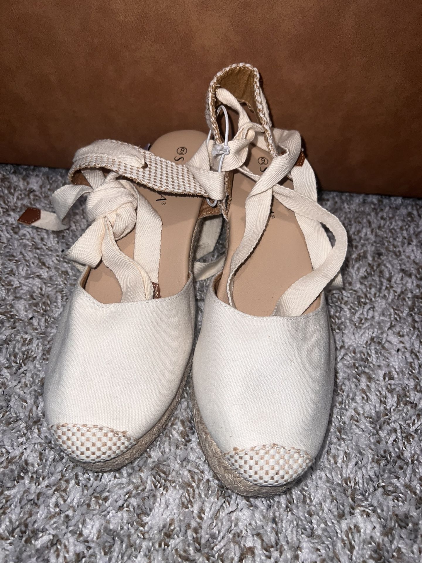 Cream-colored espadrille wedge sandals with ankle ties, size 9