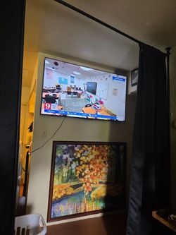 65 inch flat tv roku  only used few months moving