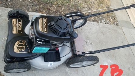 Unused Ryobi Honda engine lawn mower