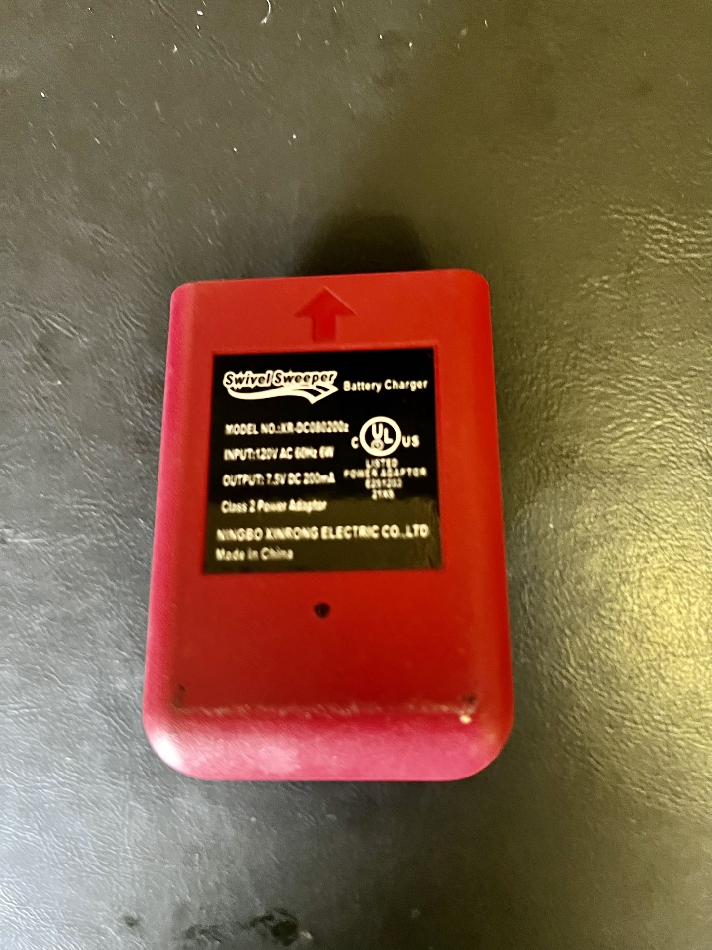 Wall charger for a cordless swivel sweeper