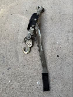 Come-along Ratchet puller.