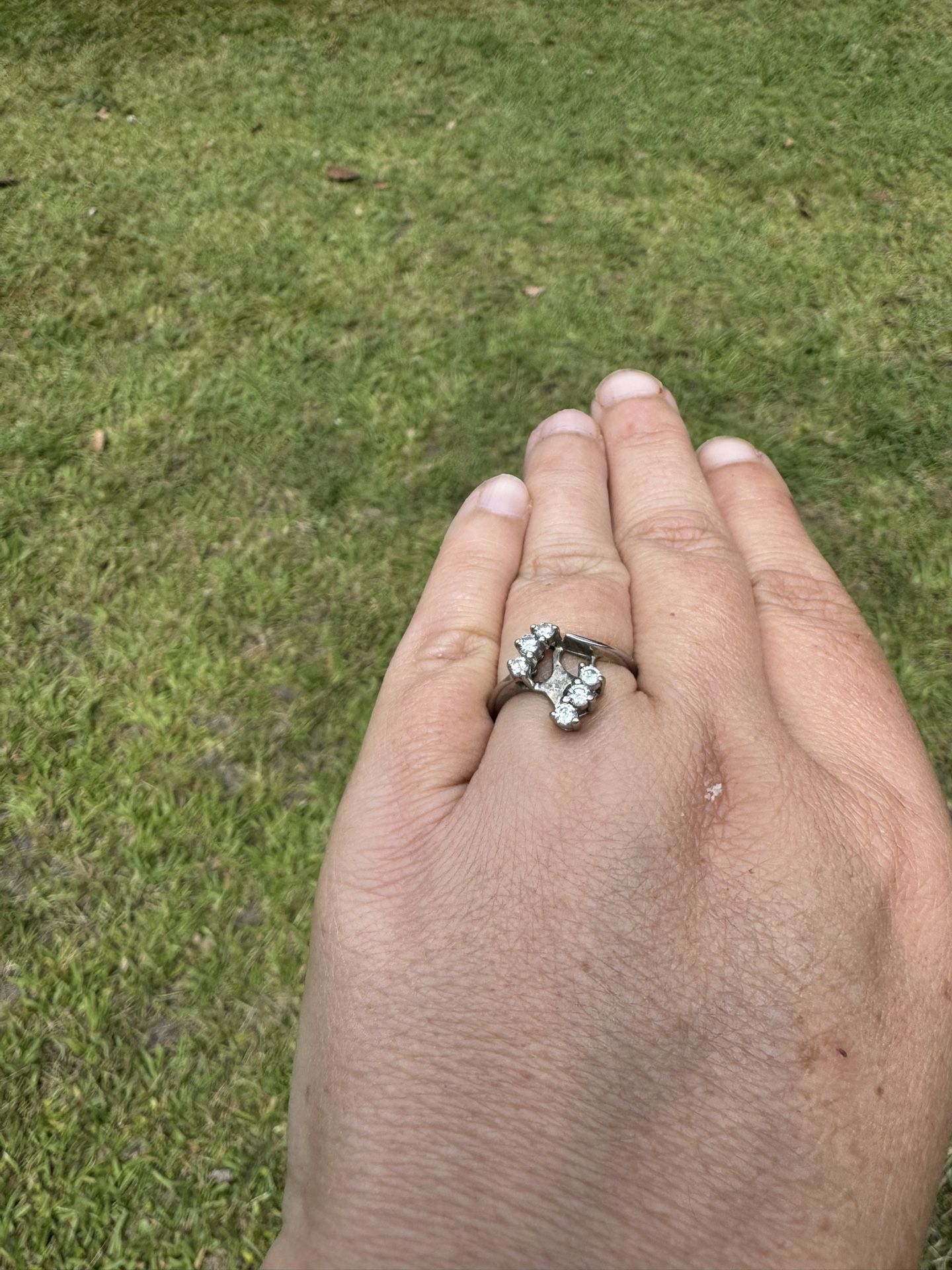 One 14k white gold bypass style channel set engagement ring,