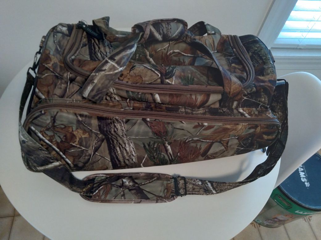 New never used medium sized camo duffle/hunting/sports bag