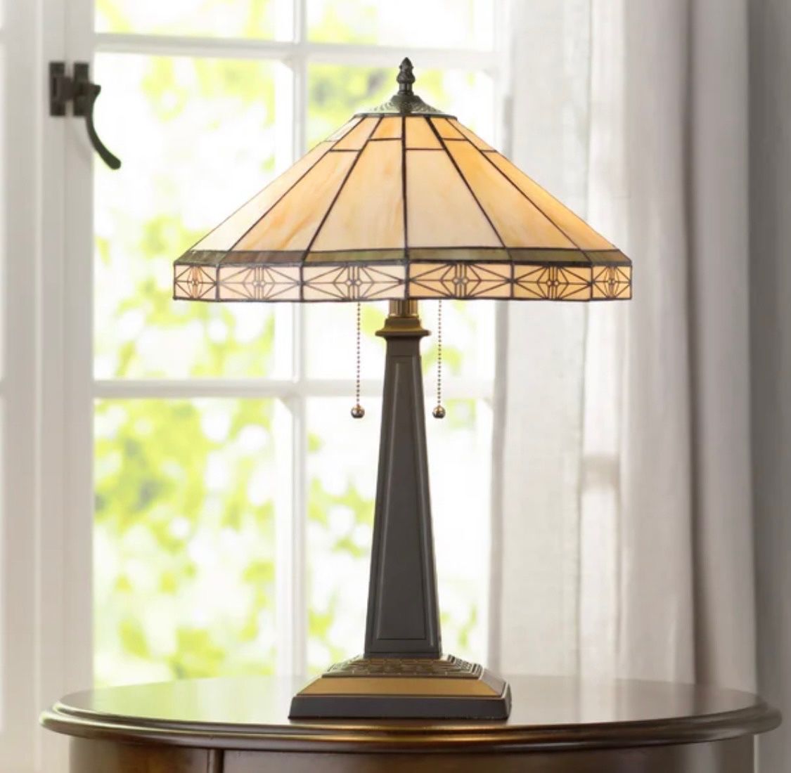 Charlotte 22.6” table lamp. 22.6 H x 15.9 W. Color base: gray. Shade: ivory, touches of tan, green. MSRP: $100. Our price: $100 + Sales tax