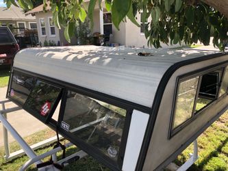 Camper Shell  vintage. 60x76ling with key was in Nissan I’ll fit by small truck
