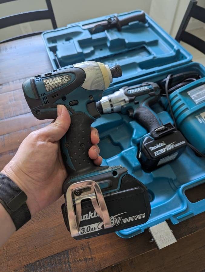 Makita hammer drill and impact driver set with 2 18v batteries, charger, and carrying case