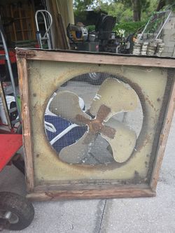 vintage belt-driven attic exhaust or window fan.