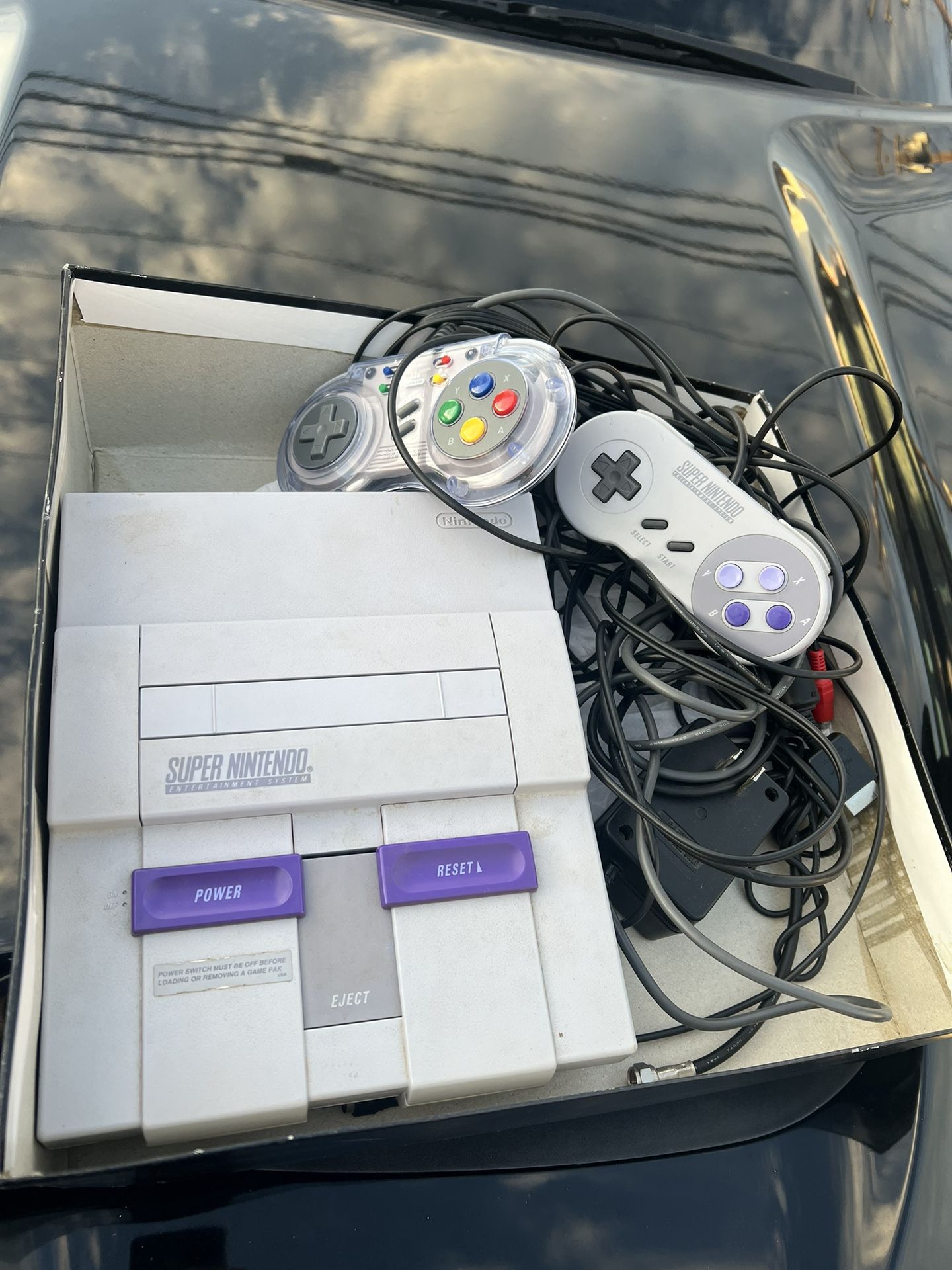 super nintendo with games