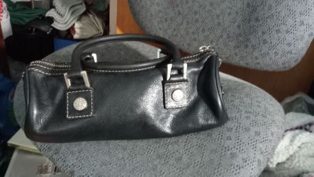 Michael Kors mini purse. Genuine Leather , zipper closure and one inside pocket.
