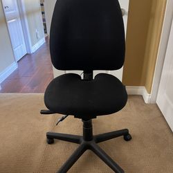 Desk chair with coccyx cut out