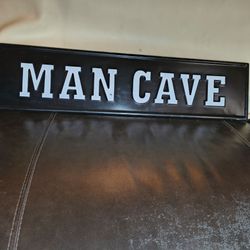Black metal stamped sign