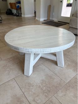 Rustic, whitewashed round coffee table