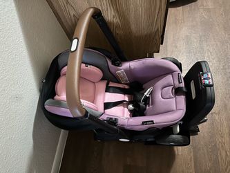 Pink Evenflo shyft dualride car seat, stroller and base