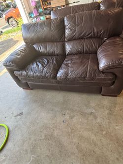 Brown Leather love seat and couch
