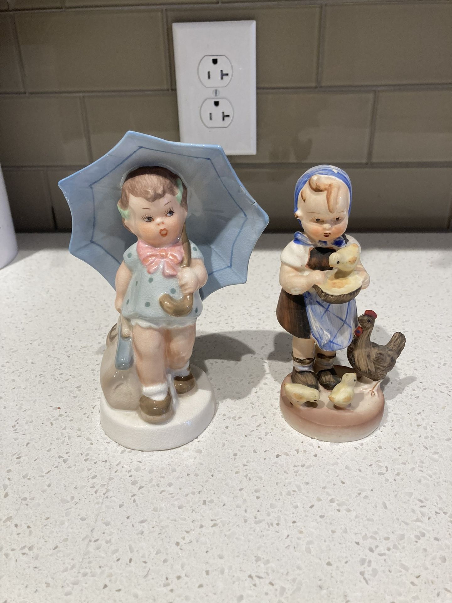 Hummel statues-2 counts- spring themed