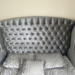Queen Bed With a Dresser And A Mirror 