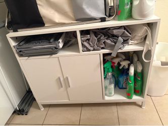 Hidden cat litter box furniture or laundry cupboard