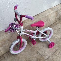 12 inch pink huffy bike